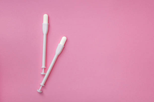 istock Two vaginal suppositories on a pink background. Caring for women's health. Close-up. Selective focus. Flat lay 2195303814
