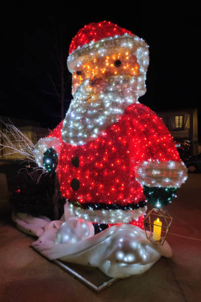 istock Big Santa Claus decoration illuminated by night 2195305358