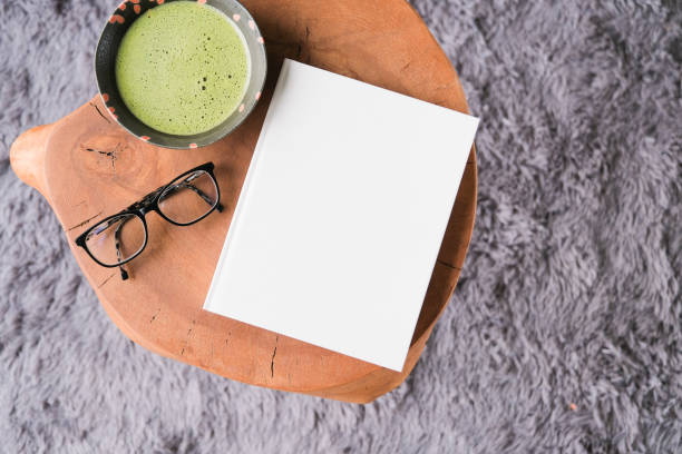 istock blank book cover mockup on coffee table with green matcha tea 2195305729