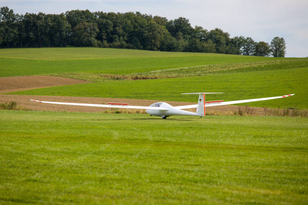 Germany Ratingen, view to a white plane on a green field