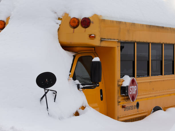 istock Snow Covered School Bus in Winter Snow Day 2195311510