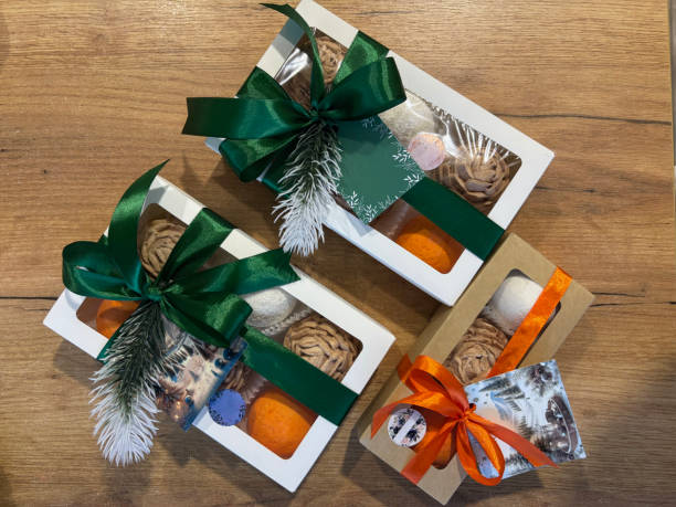 istock Marshmallows in gift box. Homemade marshmallows shaped like cones and tangerines. Three with labels for the brand. 2195312115