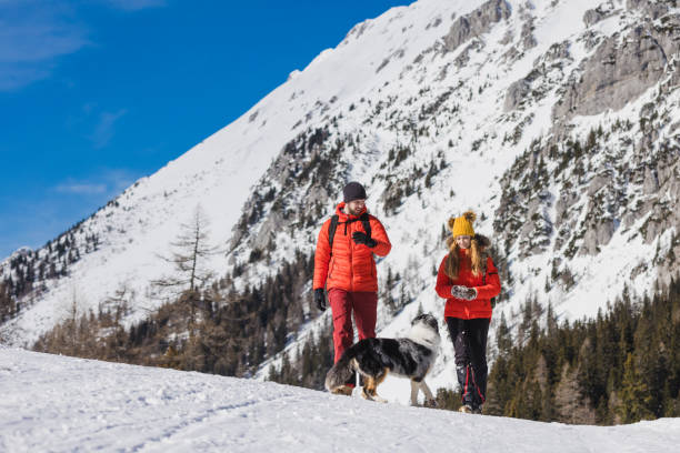 istock Couple enjoys a day outdoors on a snowy mountain 2195312331