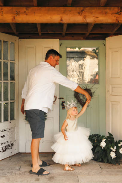 istock Little Girl Dancing With Her Dad 2195312410