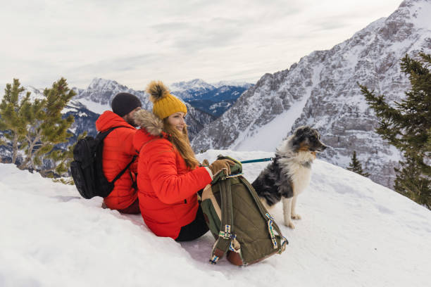 istock Couple enjoys a day outdoors on a snowy mountain 2195312492