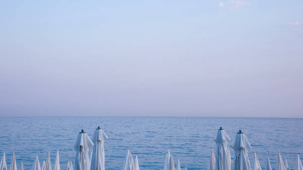 umbrellas on the beach by sunset