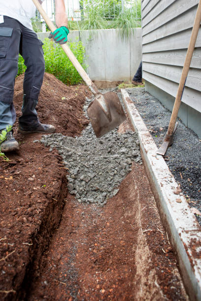 istock Worker putting gravel into a trench 2195314825