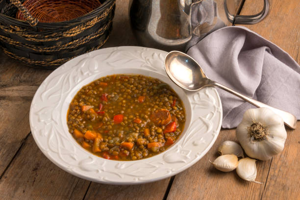 istock Plate of lentils and garlic on rustic table 2195314990