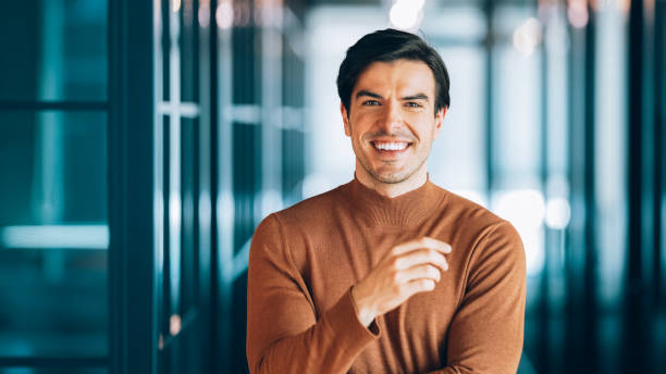 istock Confident businessman standing in a modern office 2195321528