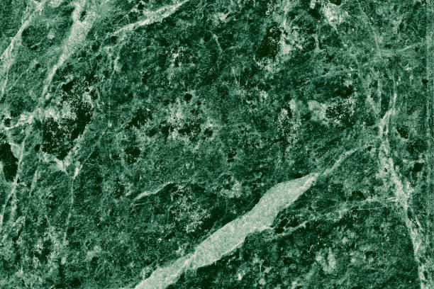 istock Real closeup of dark green marble stone texture surface background. Design pattern with high resolution for luxury home decoration. Abstract matt slab rock material. Front view of natural tiles stone surface. 2195322038