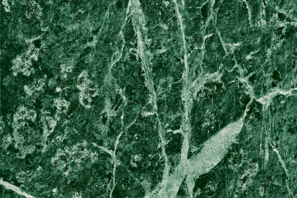 istock Real closeup of dark green marble stone texture surface background. Design pattern with high resolution for luxury home decoration. Abstract matt slab rock material. Front view of natural tiles stone surface. 2195322039