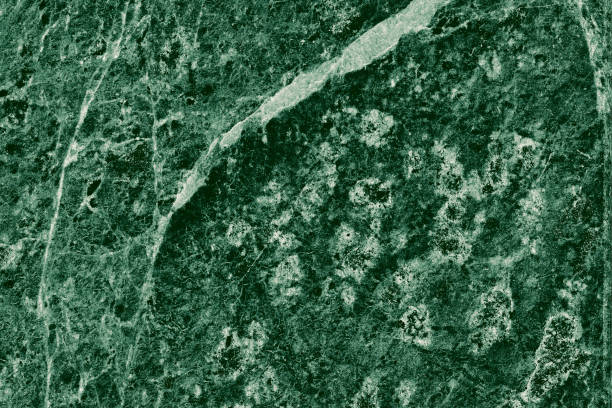 istock Real closeup of dark green marble stone texture surface background. Design pattern with high resolution for luxury home decoration. Abstract matt slab rock material. Front view of natural tiles stone surface. 2195322053