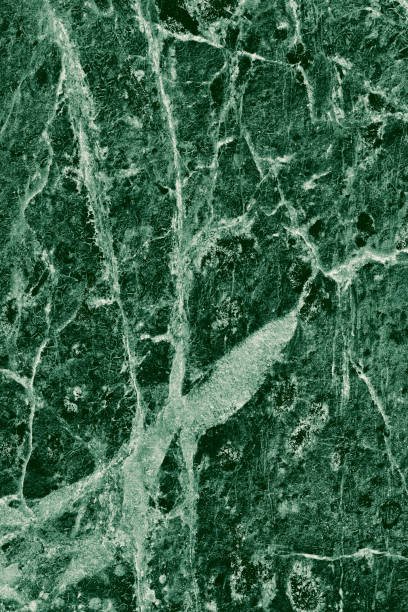 istock Real closeup of dark green marble stone texture surface background. Design pattern with high resolution for luxury home decoration. Abstract matt slab rock material. Front view of natural tiles stone surface. 2195322084