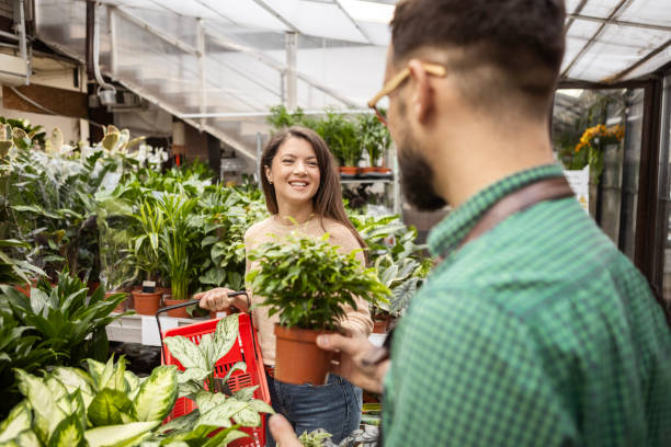 istock Customer Receiving Expert Advice from Florist on Potted Plants 2195322961