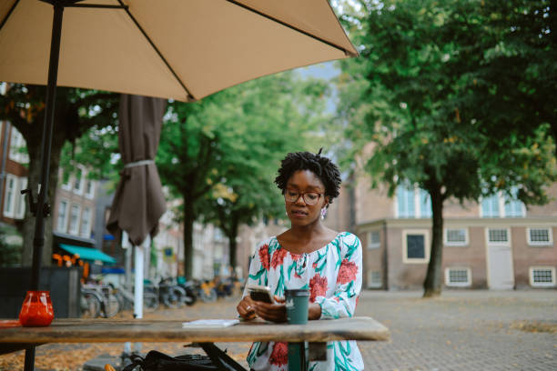 istock Woman relaxing in Amsterdam cafe 2195325792