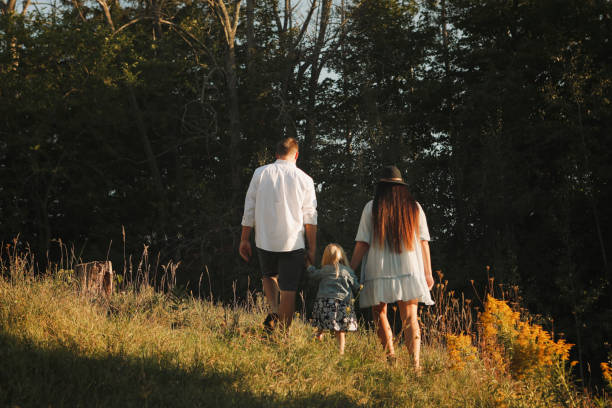 istock Family Walking Outside 2195326474