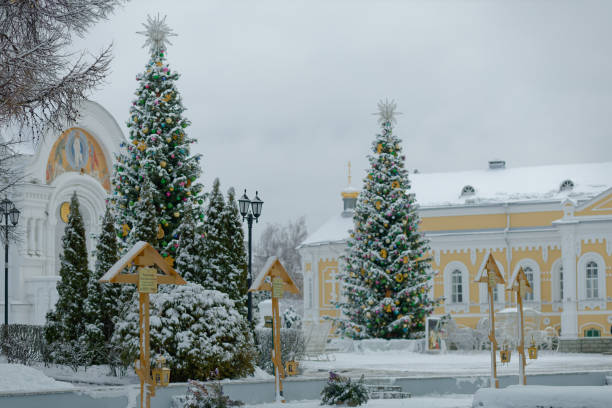istock Snowy courtyard with a large Christmas tree in the center 2195326511