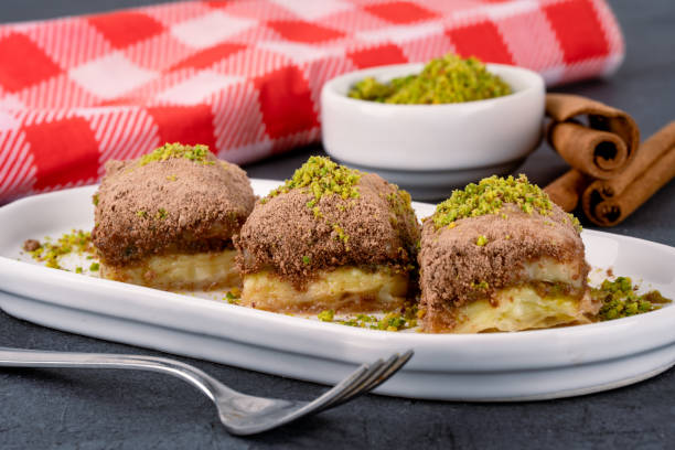 istock Turkish dessert cold baklava on black background 2195329254