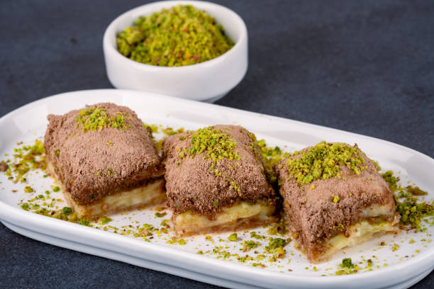 istock Turkish dessert cold baklava on black background 2195329274