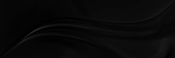 istock Black gray satin dark fabric texture luxurious shiny that is abstract silk cloth panorama background with patterns soft waves blur beautiful. 2195332505