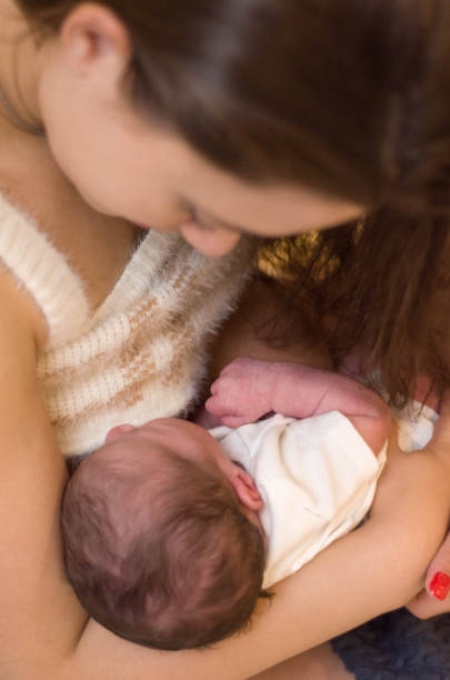 istock Young mother breastfeeding newborn baby 2195334384