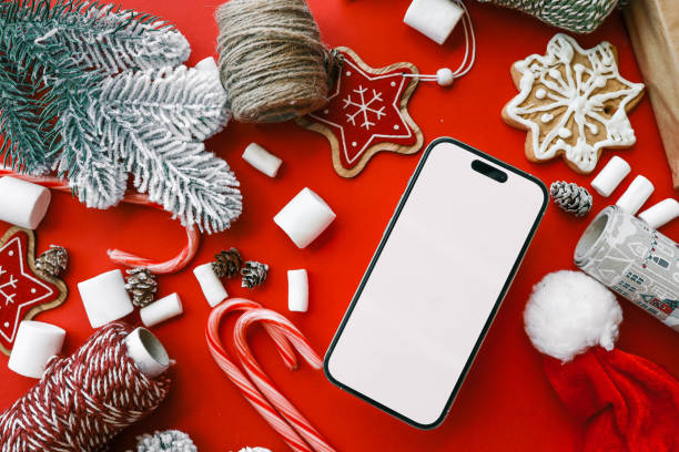 istock Phone with isolated screen against christmas decor background, online shopping 2195334458