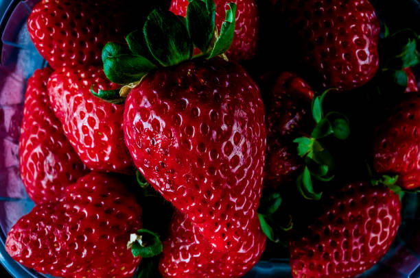 A close up of a bunch of red strawberries