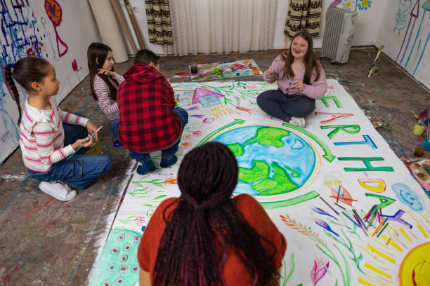 istock Diverse Children and Teacher Drawing for Earth Day 2195337042