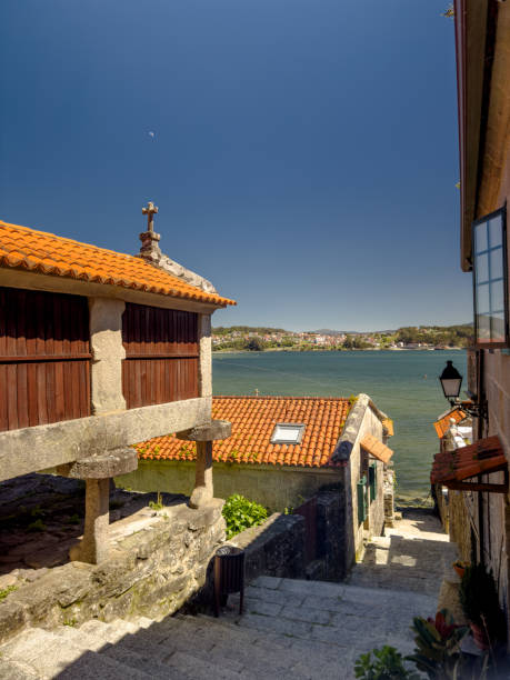 istock Traditional Granary and Stone Pathway Leading to a Scenic Lake 2195337645
