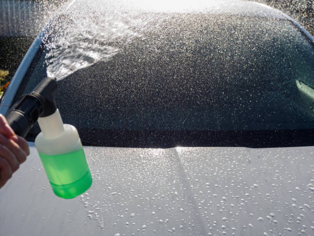 istock Manual car high-pressure wash using equipment for effective dirt removal and coating protection. 2195338198