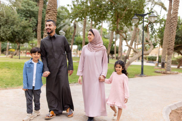 istock Middle Eastern couple strolling with children in garden 2195339543