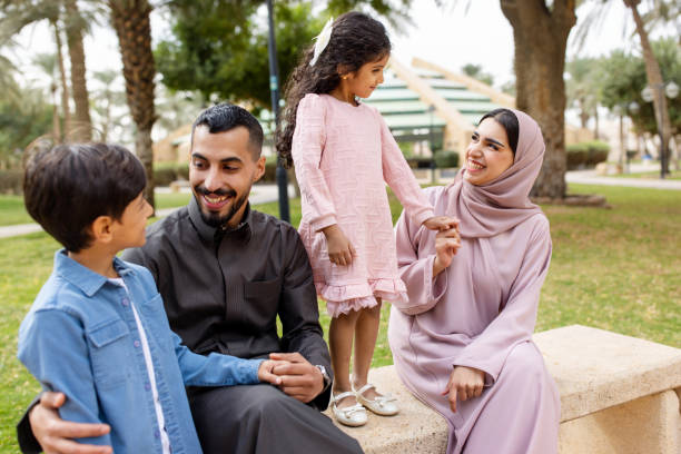 istock Middle Eastern family enjoying time together on park bench 2195339598
