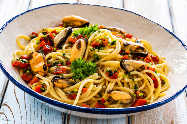 istock Noodles with mussels on wooden table 2195339669