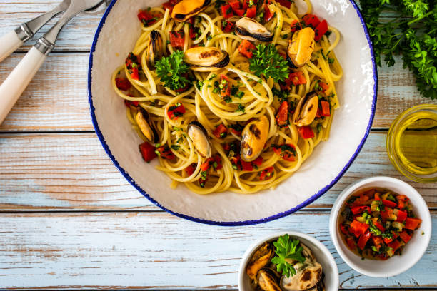 istock Noodles with mussels on wooden table 2195339692
