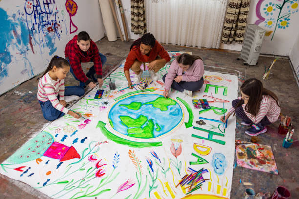 istock Happy Classroom Painting for Earth Da 2195340327