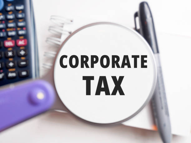 istock CORPORATE TAX text under magnification tax background 2195341983
