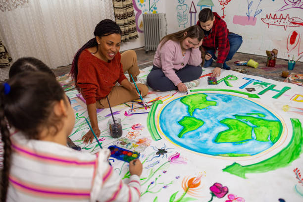 istock Diverse Kids Painting Together for Earth Day 2195342578