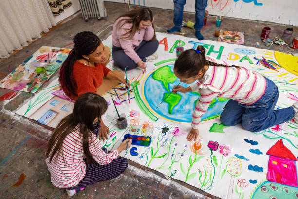 istock Happy Students Engaged in Earth Day Creativity 2195342579