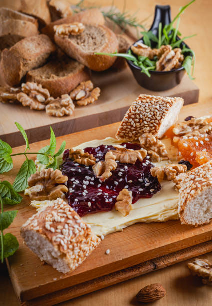 istock Delicious butter board with jam, nuts, and sesame bread 2195343076