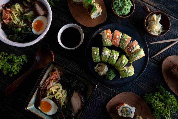 Sushi set on a wooden plate and dark background