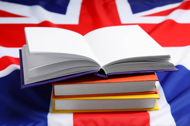 istock Learning foreign language. Different books on flag of United Kingdom 2195349975