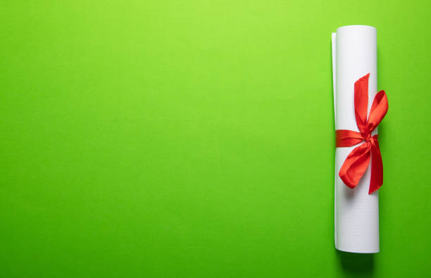 Diploma on the green background. Education