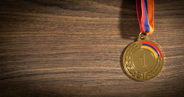 Medal awards for winner on wooden background.