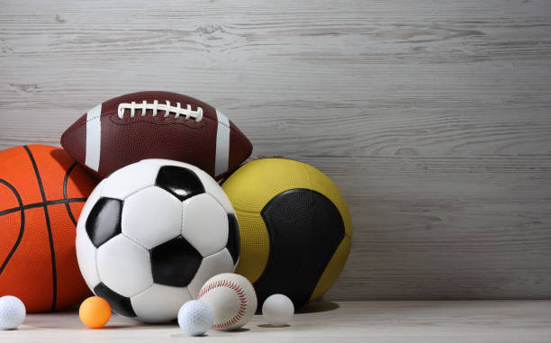 istock Many different sport balls on white wooden background, space for text 2195351797