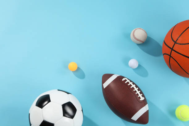 istock Many different sports balls on light blue background, flat lay. Space for text 2195351812