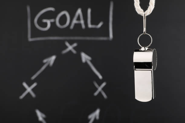 istock Referee whistle against chalkboard with game scheme, closeup. Space for text 2195351854