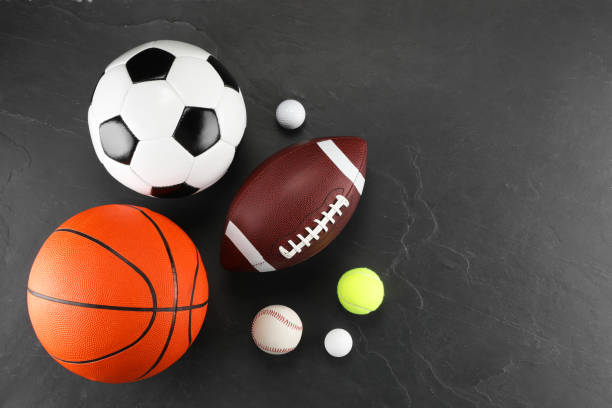 istock Many different sports balls on dark gray background, flat lay. Space for text 2195351876