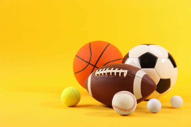 istock Many different sports balls on yellow background, space for text 2195351988