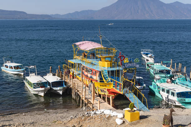 San Juan La Laguna, Solola, Guatemala. March 12, 2024. Passenger boat at a dock on Lake Atitlan.