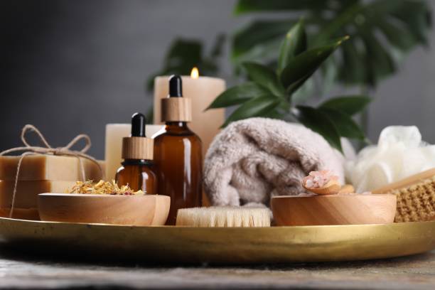 istock Spa composition. Brush, bottles and sea salt on table, closeup 2195353982